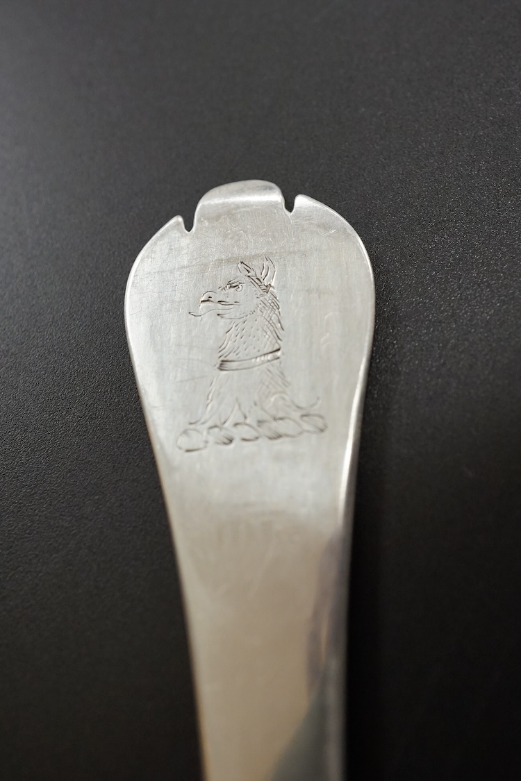 A late William III Britannia standard silver trefid spoon, by William Scarlett, London, 1701, with rat-tail bowl and later? engraved crest, 19.7cm, 52 grams.